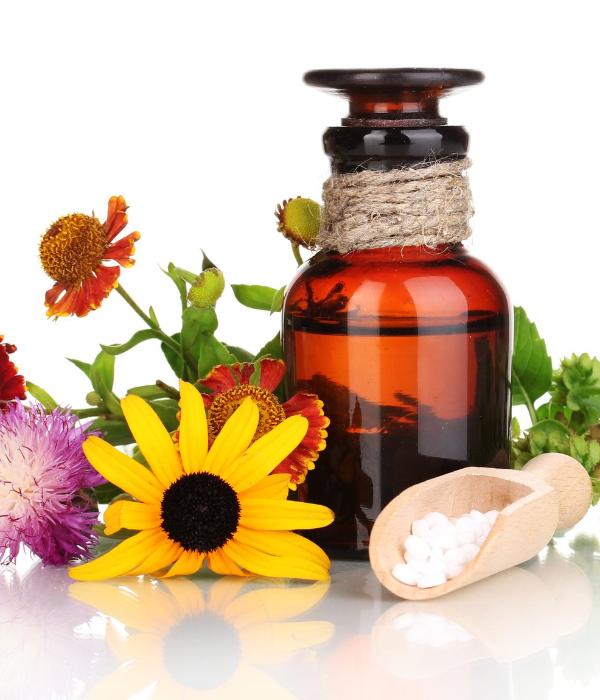 Homeopathy vial with flowers