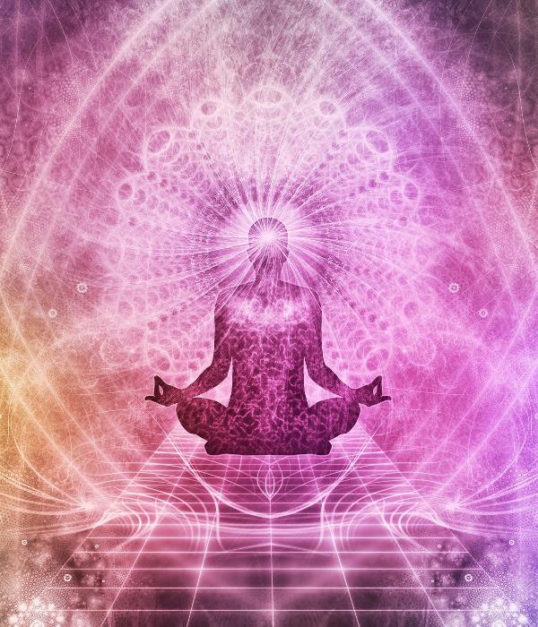 Vibrational healing energy fields surrounding meditating human