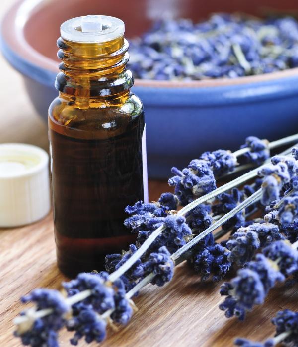 Aromatherapy vial and bowl of lavender 