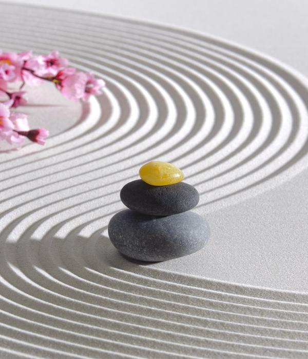 Feng shui piled rocks in zen sand pattern