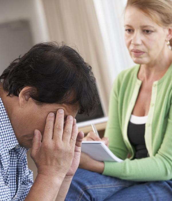 Empathetic counsellor with client experiencing stress